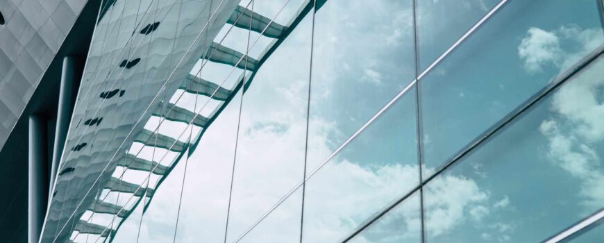 facade large windows of modern business office building in metropolitan. hall shopping mall glass window design
